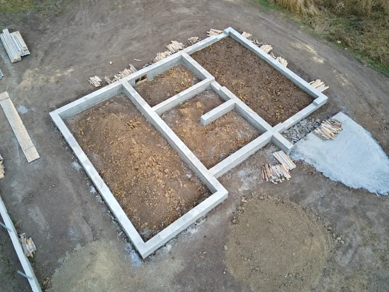 Excavator preparing a Central Texas property for excavation before winter